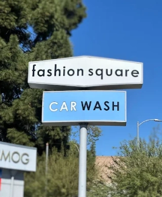 Fashion Square Car Wash and Smog sign against a clear blue sky